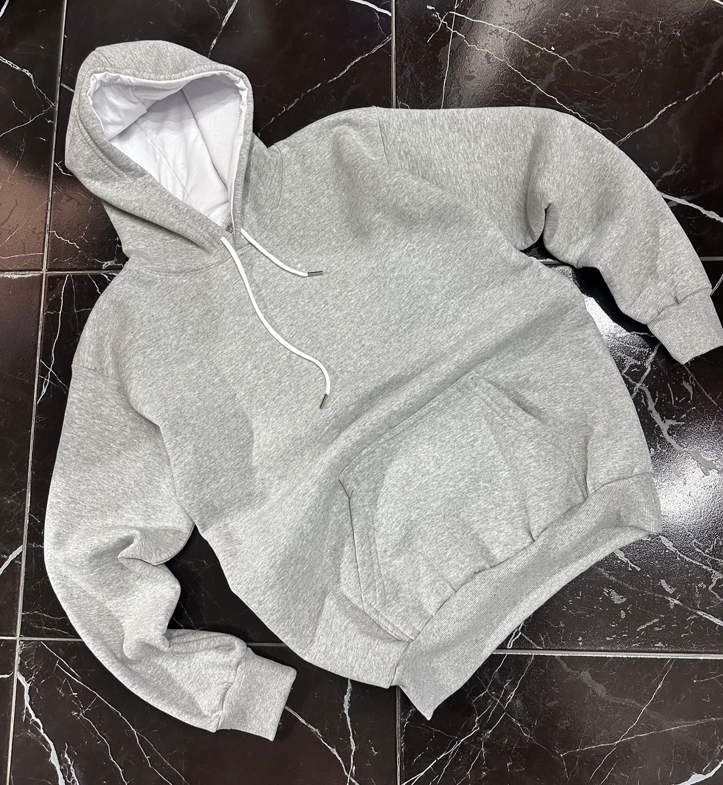 BUZO CANGURO UNISEX GRIS MELANGE